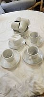 Stacked saucers and inverted cups showing full set