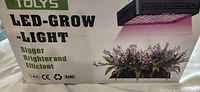 Retail box front showing Tolys branding and LED-Grow-Light text