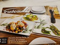 Retail box front showing Trudeau 3-piece porcelain serving platter set