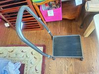 Top view of step stool showing platform and handle