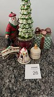 All six ceramic holiday pieces grouped on countertop