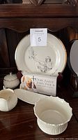 All five Lenox porcelain pieces grouped together on display