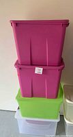 Stacked view of five totes showing colors and lids