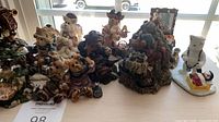 Wide view of assorted small resin figurines on tabletop