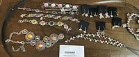 Entire lot displayed on table showing necklaces, bracelets, earrings
