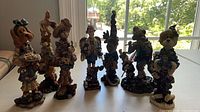 Front view of all seven resin bear figurines on table