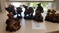 All seven teddy bear figurines displayed on tabletop