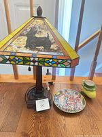 Lamp, plate and mug grouped together