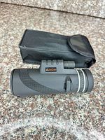 Monocular beside carrying pouch