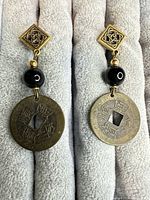 front view of both earrings showing design and materials