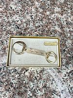 Keychain in presentation box showing full view