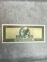 Obverse of 1955 50 Drachmai note showing helmeted warrior, denomination, serial number