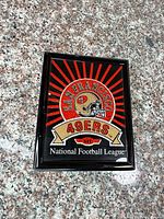 Front view of framed plaque showing logo and colors