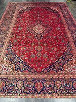 Full view of Kashan rug showing complete field, medallion and borders