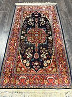 Full view of rug showing entire design and fringe