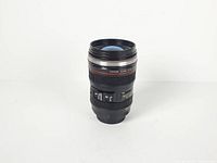 Mug front view showing exterior lens details