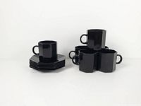 Stack of saucers beside stacked cups shows full lot and counts