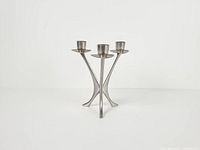 Front three-quarter view showing overall shape and tripod base