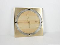 Front view showing entire clock, frame, dial and hands