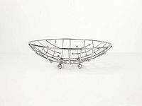 Side view showing chrome wire basket with ball feet
