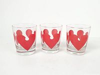 Front view of three matching tumblers showing heart graphics