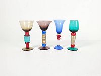 Front view of all four multicolor shot glasses