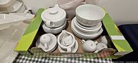 overview of boxed Arzberg dinnerware pieces