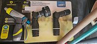 Retail-packaged Yardworks adjustable nozzle and two Orbit high-flow nozzles