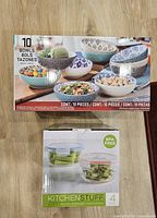 Both product boxes: 10-piece bowl set and KitchenStuff glass container set