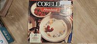 Front of sealed Corelle Impressions Abundance 20-piece set box showing pattern and service count