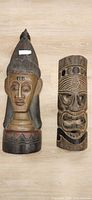 Two carved wooden pieces: bust and cylindrical tiki mask
