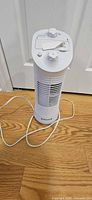 Front view showing entire Honeywell tower fan, controls, grille and power cord