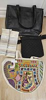 Overview of four bags showing black tote, metallic patchwork tote, quilted black crossbody, embroidered cotton tote