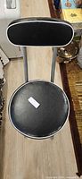 Top view showing padded round seat and oval backrest