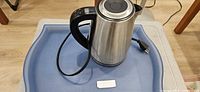 Kettle on tray showing full lot