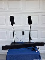 Sound bar, two satellite speakers on stands