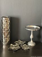 All five silver items grouped together