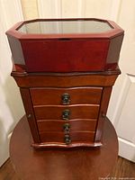 Mahogany jewelry chest with separate glass-top musical box stacked above