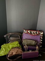 Grouped view of six handbags showing colors, styles and relative sizes