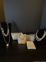 Group shot of all clutches and necklaces