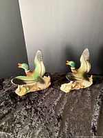 Front view of both ceramic mallard duck lamps showing glaze colors and cords