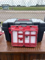 Front view of toolbox with Milwaukee Packout case leaning against it