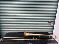 Full view of trombone showing overall length, bell, slide sections