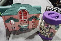 Dollhouse front view with jar of bricks