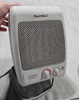 Front view of Maxi-Heat heater showing grille, controls, brand logo