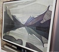 Front view of framed Lawren Harris print showing landscape image and frame