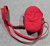 Full view of red Lululemon Team Canada crossbody bag
