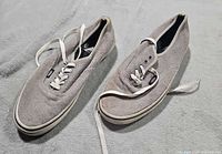 Top view of both sneakers showing overall style, color, and wear