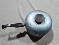 Full view of saucepan with lid and handle