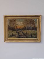 Framed oil painting on wall
